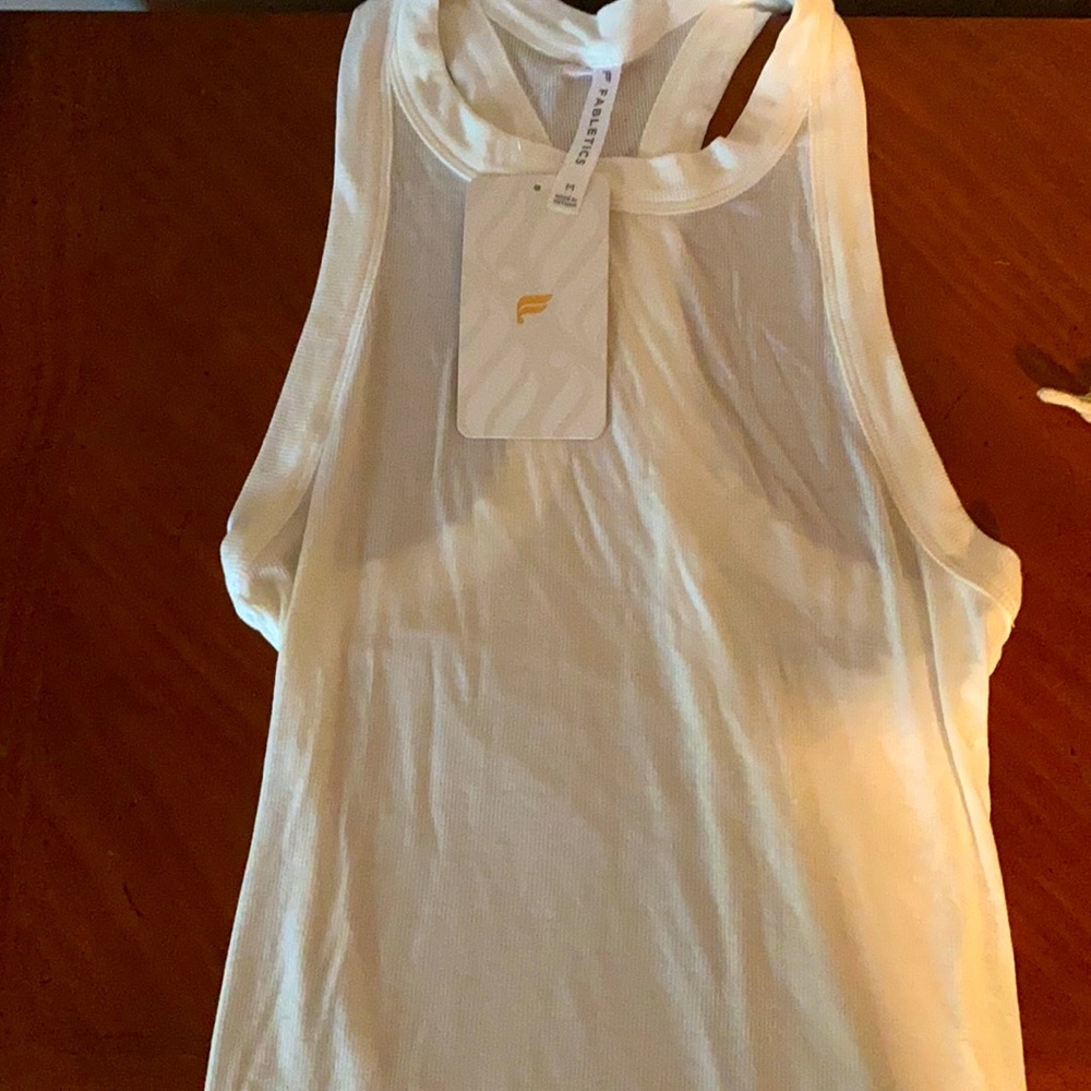 White tank with tags on it